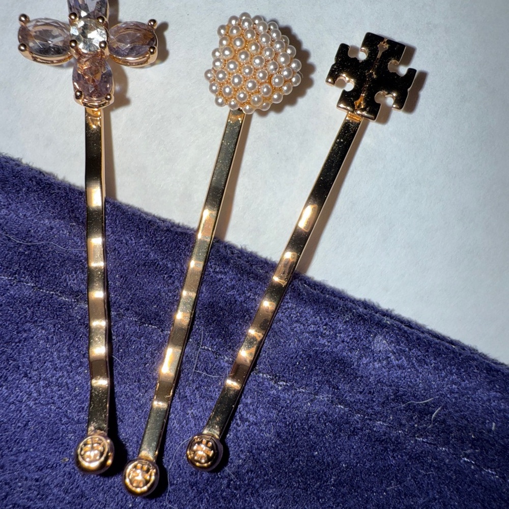Tory Burch Golden 3 pc.Set Hair Pin Set 
Bobby pins.Never worn w/bag..